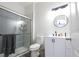 Modern bathroom boasts a stylish vanity, sleek fixtures, and a glass-enclosed shower, ensuring a comfortable experience at 7123 Yacht Basin Ave # 3, Orlando, FL 32835