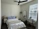 Bedroom with a bed, desk, and a large window at 7123 Yacht Basin Ave # 3, Orlando, FL 32835