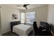 Bedroom with a bed, workspace, and window with blinds at 7123 Yacht Basin Ave # 3, Orlando, FL 32835