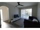 Living room with sliding door to balcony and gray sofa at 7123 Yacht Basin Ave # 3, Orlando, FL 32835