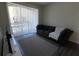 Living room with sliding door to balcony and gray sofa at 7123 Yacht Basin Ave # 3, Orlando, FL 32835