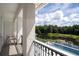 Balcony overlooking a pool and tranquil lake at 717 Eastlawn Dr, Kissimmee, FL 34747