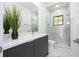 Modern bathroom with marble shower, vanity, and contemporary design at 717 Eastlawn Dr, Kissimmee, FL 34747