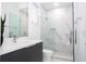 Contemporary bathroom with marble shower and gray vanity at 717 Eastlawn Dr, Kissimmee, FL 34747