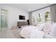 Light and airy bedroom with twin beds and en-suite bathroom at 717 Eastlawn Dr, Kissimmee, FL 34747