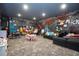 Fun ' playroom with a mural, seating, and playful decor at 717 Eastlawn Dr, Kissimmee, FL 34747