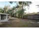 Large backyard with wooden fence and lush greenery at 748 N Gretna Ct, Winter Springs, FL 32708