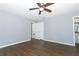 Bedroom with wood-look floors and access to bathroom at 748 N Gretna Ct, Winter Springs, FL 32708