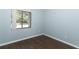 Bright bedroom with dark wood floors and window at 748 N Gretna Ct, Winter Springs, FL 32708