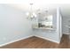 Light and bright dining room with hardwood floors and a chandelier at 748 N Gretna Ct, Winter Springs, FL 32708