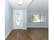 Bright entryway with wood-look floors and a glass-paned door at 748 N Gretna Ct, Winter Springs, FL 32708