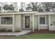 Inviting front entrance with a decorative door and landscaping at 748 N Gretna Ct, Winter Springs, FL 32708