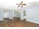 View of kitchen and living area with wood-look floors at 748 N Gretna Ct, Winter Springs, FL 32708