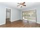 Living room with wood-look floors and access to patio at 748 N Gretna Ct, Winter Springs, FL 32708