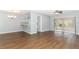 Bright living room with hardwood floors and access to a back patio at 748 N Gretna Ct, Winter Springs, FL 32708