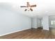 Open living room with wood-look floors and high ceiling at 748 N Gretna Ct, Winter Springs, FL 32708