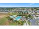 Community pool and surrounding homes from above at 764 Sarner Pass Way, Winter Haven, FL 33881