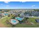 Community pool, playground, and homes from above at 764 Sarner Pass Way, Winter Haven, FL 33881