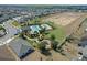 Community pool, playground, and homes from above at 764 Sarner Pass Way, Winter Haven, FL 33881