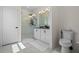 Modern bathroom with double vanity and a walk-in shower at 764 Sarner Pass Way, Winter Haven, FL 33881