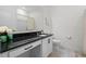 Bathroom with dark countertop and white cabinets at 764 Sarner Pass Way, Winter Haven, FL 33881