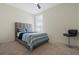 Guest bedroom with a queen bed and carpet flooring at 764 Sarner Pass Way, Winter Haven, FL 33881