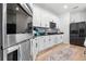 Modern kitchen with stainless steel appliances and white cabinets at 764 Sarner Pass Way, Winter Haven, FL 33881