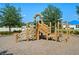 Community playground with play structures and wood chips at 764 Sarner Pass Way, Winter Haven, FL 33881