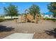 Community playground with play structures and wood chips at 764 Sarner Pass Way, Winter Haven, FL 33881