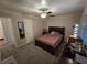 Cozy bedroom with double bed, ceiling fan, and mirrored closet at 820 W 25Th St, Sanford, FL 32771