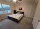 Bright bedroom featuring a double bed, large window, and ceiling fan at 820 W 25Th St, Sanford, FL 32771