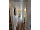 Light hallway with wood flooring, leading to bedrooms and bath at 820 W 25Th St, Sanford, FL 32771