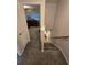 Upstairs hallway with carpeted floors and access to bedrooms at 820 W 25Th St, Sanford, FL 32771