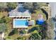 Aerial view of community pool, playground, and parking at 900 Khingan Ct, Apopka, FL 32712