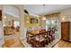 Bright dining room with wood table and chairs, near living room at 900 Khingan Ct, Apopka, FL 32712