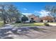 Front view of charming house with sidewalk and trees at 900 Khingan Ct, Apopka, FL 32712