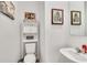 Small half bathroom with a toilet and a single sink at 914 Spring Palms Loop, Orlando, FL 32828