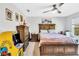 Bedroom with a double bed, dresser and a vintage arcade game at 914 Spring Palms Loop, Orlando, FL 32828