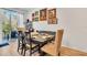 Dining room with wooden table and bench seating near sliding doors at 914 Spring Palms Loop, Orlando, FL 32828