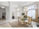 Elegant dining room with a glass-top table and chandelier at 111 Millholland St, Oakland, FL 34760