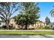 House with solar panels and mature trees at 111 Millholland St, Oakland, FL 34760