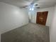 Bedroom with carpet flooring and ceiling fan at 113 W 1St St, Debary, FL 32713