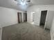 Main bedroom with carpet flooring and walk-in closet at 113 W 1St St, Debary, FL 32713