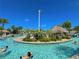 View of the community lazy river with tropical island and bridge at 1312 Shinnecock Hills Dr, Davenport, FL 33896