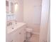 Bathroom with white vanity and toilet at 1401 W Highway 50 # 138, Clermont, FL 34711