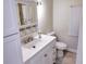 Bright bathroom with white vanity, updated fixtures and a medicine cabinet at 1401 W Highway 50 # 138, Clermont, FL 34711