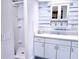 Clean bathroom with a shower, vanity, and wood-look walls at 1401 W Highway 50 # 138, Clermont, FL 34711