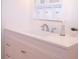 White bathroom vanity with quartz countertop and brushed nickel fixtures at 1401 W Highway 50 # 138, Clermont, FL 34711