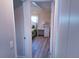 Bright bedroom with white wicker furniture and wood-look flooring at 1401 W Highway 50 # 138, Clermont, FL 34711