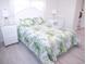 Cozy bedroom with full-size bed and wicker furniture at 1401 W Highway 50 # 138, Clermont, FL 34711
